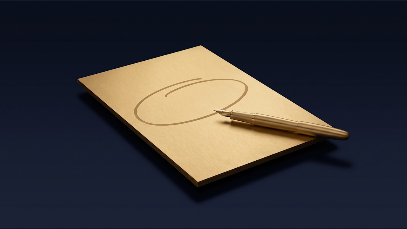 A manuscript is being marked up with one paragraph circled and a pen resting on the next line